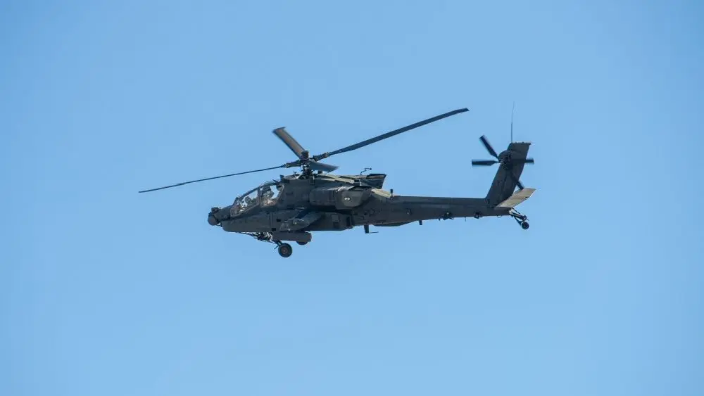 Army Apache AH-64 Helicopter during the Dragoon Ride Exercise on March 22^ 2015 in Vilnius^ Lithuania. The Boeing AH-64 Apache is a four-blade^ twin-turboshaft attack helicopter. VILNIUS - MAR 22