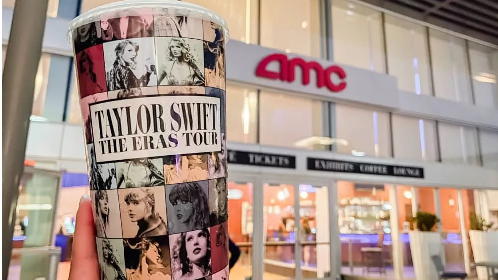 Taylor Swift The Eras Tour Film logo in front of AMC theaters