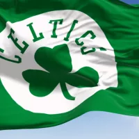 Boston Celtics flag^ waving in the wind on a clear day. American professional basketball team^ Eastern Conference