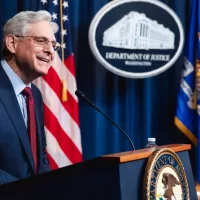 United States Attorney General^ Merrick Garland delivering a speech behind a podium with a mic. Washington D.C.^ USA - Oct 26 2023