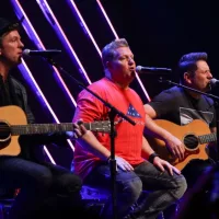 Joe Don Rooney^ Gary LeVox and Jay DeMarcus (L-R) of Rascal Flatts perform at CBS Radio's Stars & Stripes event at the Chicago Theatre on November 9^ 2016 in Chicago^ Illinois.