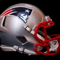 NFL club New England Patriots replica helmet on black background ^ product shot