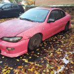 2002 Pontiac Sunfire with $1k Nissan silvia headlights & car is only worth maybe $300 in scrap weight. Sunroof is stuck open, no carpet, and graffiti on the door panels. 1 sideskirt, no alignment in 10+ years, but has never let me down.