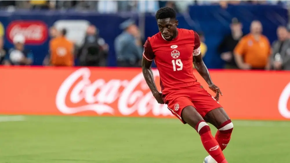 Alphonso Davies (19) of Canada controls ball during Conmebol Copa America 2024 semifinal match against Argentina at MetLife Stadium in East Rutherford^ NJ on July 9^ 2024
