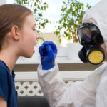 male-doctor-in-protective-suit-and-mask-taking-swab-sample-from-child-coronavirus-test