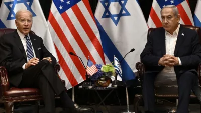 US President Joe Biden (L) listens to Israel's Prime Minister Benjamin Netanyahu as he joins a meeting of the Israeli war cabinet in Tel Aviv on October 18^ 2023