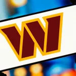 In this photo illustration^ the Washington Commanders logo is displayed on a smartphone screen