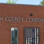 Moscow^ ID^ USA - May 23^ 2023; Text sign for Latah County Courthouse in Moscow Idaho on brick wall