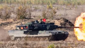 Pabrade Lithuania A Leopard 2A7 main battle tank is captured in action^ firing its main cannon during a live-fire exercise. 10-13 - 2020