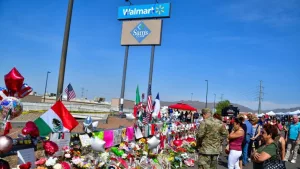 Flowers^ posters^ toys and other memorabilia left for the victims of the Walmart shooting on 3 August 2019. El Paso^ Texas / USA - August 2019