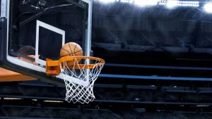 basketball going into hoop at arena (NBA)