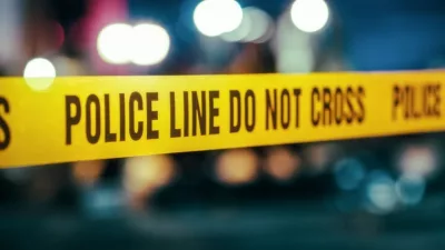 Yellow Tape Showing Text "Police Line Do Not Cross" Restricting a Crime Scene Area At Night. Close Up Aesthetic Shot with Bokeh Effect and Flickering Lights.