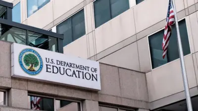 The exterior sign and US flag in front of the U.S. Department of Education offices in Washington^ DC. Washington^ DC USA; September 5^ 2024