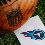 Tennessee Titans NFL team Logo and American football ball on Green Grass. TENNESSEE^ USA^ FEBRUARY 10^ 2025