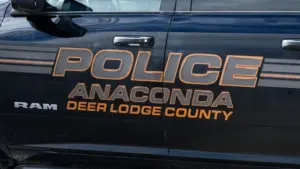 Sign on Anaconda Deer Lodge County police car in closeup. Anaconda^ MT^ USA - May 6^ 2025