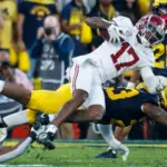 Alabama wide receiver Isaiah Bond (R)is tackled during the 2024 Rose Bowl game Monday^ Jan. 1^ 2024^ in Pasadena^ Calif.