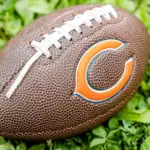 Football with Chicago Bears logo the on grass. Chicago Bears of the National Football Conference North. Rockford^ WI / USA.- Feb 12^ 2019