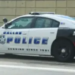 Dallas^ Texas - September 20^ 2018 a police car heading for downtown dallas