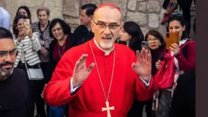 Cardinal Pierbattista Pizzaballa^ Latin Patriarch of Jerusalem^ greets the crowd as he leaves the Church of the Nativity after the Christmas celebrations. Bethlehem^ West Bank^ December 25^ 2025