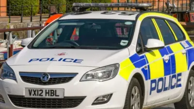 Police patrol car parked in Gloucester Quays^ which is the former docks area GLOUCESTER^ ENGLAND - SEPTEMBER 2019