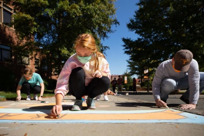 students-create-chalk-artwork-along-ped-walkway-during-homecoming-week