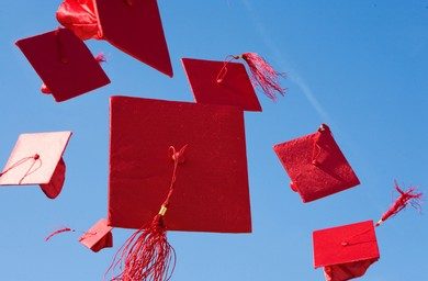 red-grad-caps-in-air