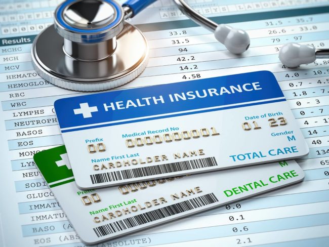 health-insurance-cards-total-and-dental-care-with-stethscope