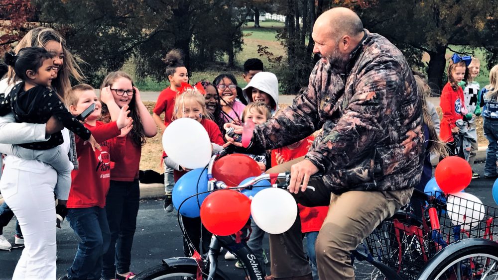 rhea-chris-on-bike