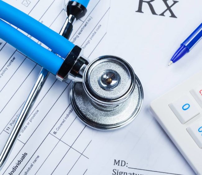 health-care-costs-stethoscope-and-calculator