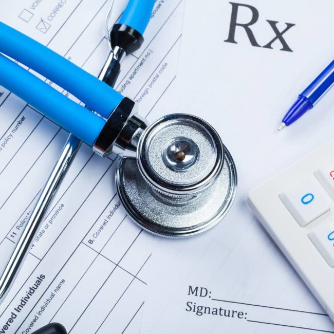 health-care-costs-stethoscope-and-calculator