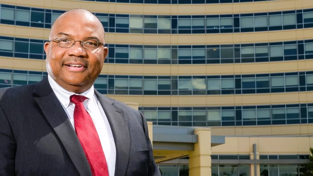 chief-operating-officer-james-ross-in-front-of-entrance-to-jmcgh