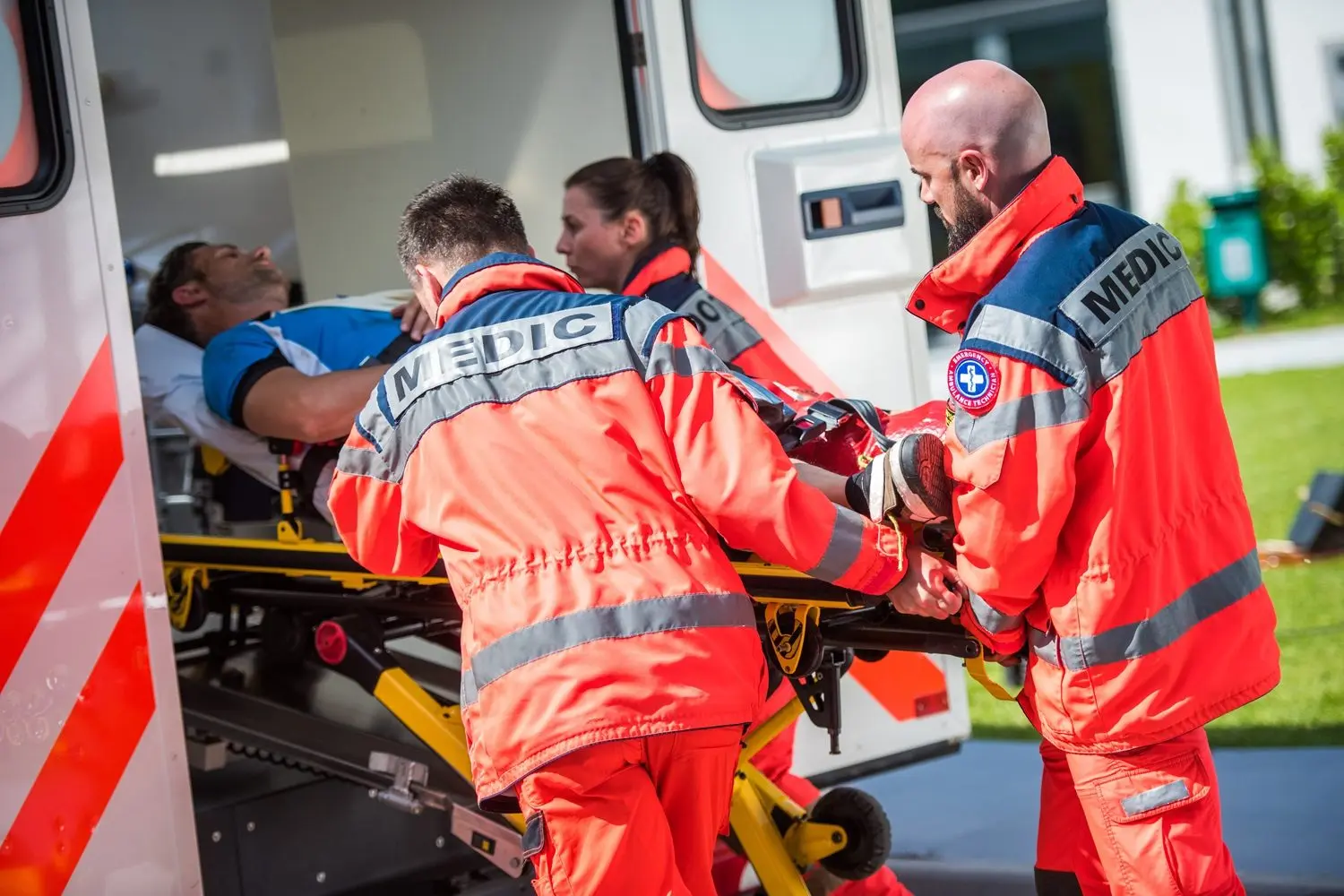 paramedic-team-pushing-stretcher