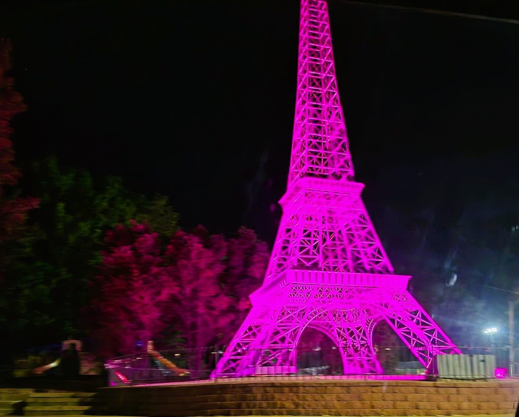 Eiffel Tower In Paris (Tennessee) Shining Pink For Dolly