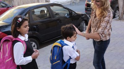 Mom saying bye to kid returning to school