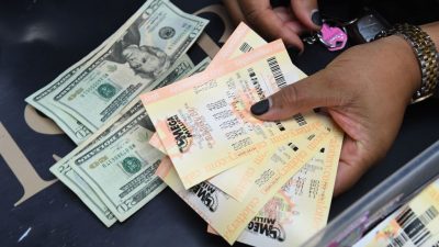 Person buying megamillions lottery tickets