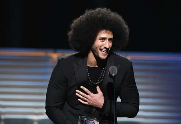 Colin Kapernick accepting Sports Illustrated awarc