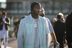 Pop Smoke is wearing a Louis Vuitton look before the Louis Vuitton AW20 Men Show on January 16, 2020 in Paris, France.