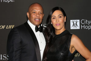 Rapper / Music Producer Dr. Dre (L) and his Wife Nicole Young (R) attend the City Of Hope Gala on October 11, 2018 in Los Angeles, California.