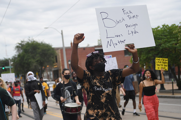 Black Lives Matter protesters demonstrate after a failed pro President Donald Trump demonstration on July 27, 2020 in St Louis, Missouri. Local Trump supporters called for a protest demonstration outside the home of St. Louis City Circuit Attorney Kim Gardner in response to her decision to file charges against Mark and Patricia McCloskey, who brandished firearms at protesters outside their home on June 28.
