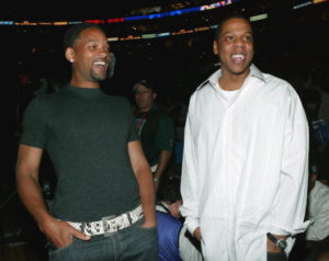 (L-R) Actor Will Smith and rap artist Jay Z attend the 2004 NBA All-Star Game held at the Staples Center, February 15, 2004 in Los Angeles, California.