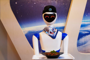 MOSUL, IRAQ - NOVEMBER 23: Robot waitresses serve customers at a restaurant which was recently opened by a group of university students in Mosul, Iraq on November 23, 2021. Robot waiters In the restaurant, take orders from customers and send them to the kitchen with the digital menu system installed on the tables. They also carry dishes to the tables.