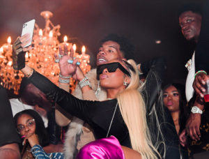 Rapper Lil Baby and Jayda Cheaves attend the Official Fight After Party at Compound on December 29, 2019 in Atlanta, Georgia.