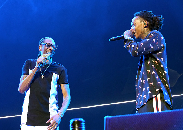 Recording artists Snoop Dogg (L) and Wiz Khalifa perform onstage at night one of the 2017 BET Experience STAPLES Center Concert, sponsored by Hulu, at Staples Center on June 22, 2017 in Los Angeles, California.