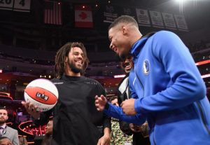 J. Cole and Dennis Smith Jr. attend the 2018 Verizon Slam Dunk Contest at Staples Center on February 17, 2018 in Los Angeles, California.
