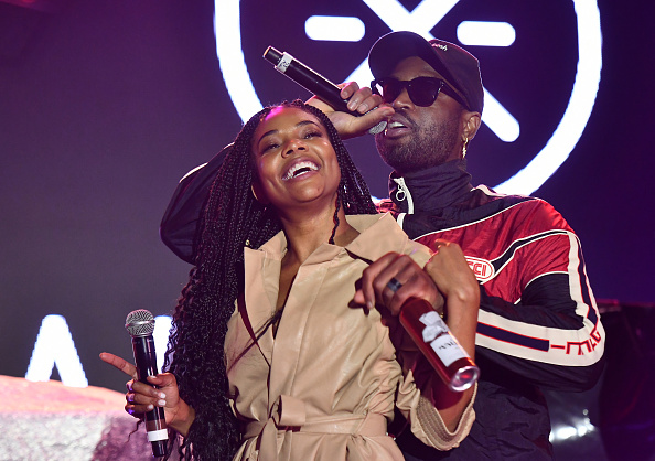 Dwyane Wade and Gabrielle Union perform onstage at ONE37pm x Dwyane Wade's Masters of the Mic Karaoke at Night Two of BUDX Miami by Budweiser on February 01, 2020 in Miami Beach, Florida.