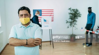 middle-aged-man-wearing-a-face-mask-on-election-day