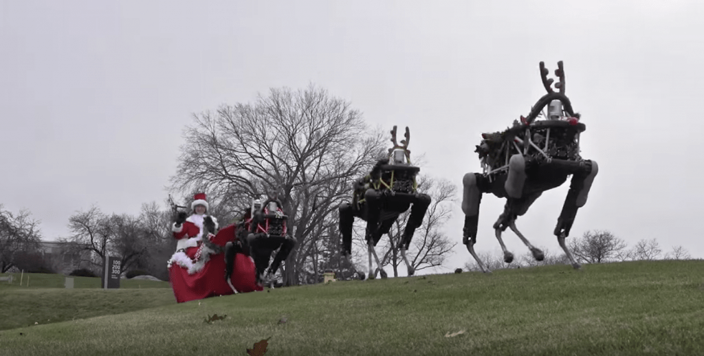 Lady riding sleigh with robot reindeer