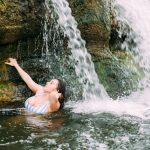 KLBJ Rock Girl Dominique: Miss KLBJ Rock Girl Dominique under a waterfall at Mckinney State Park