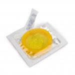 A prophylactic: yellow condom on white background
