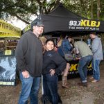 KLBJ Rocks The Nutty Brown Featuring Aaron Lewis: couple posing in front of KLBJ tent
